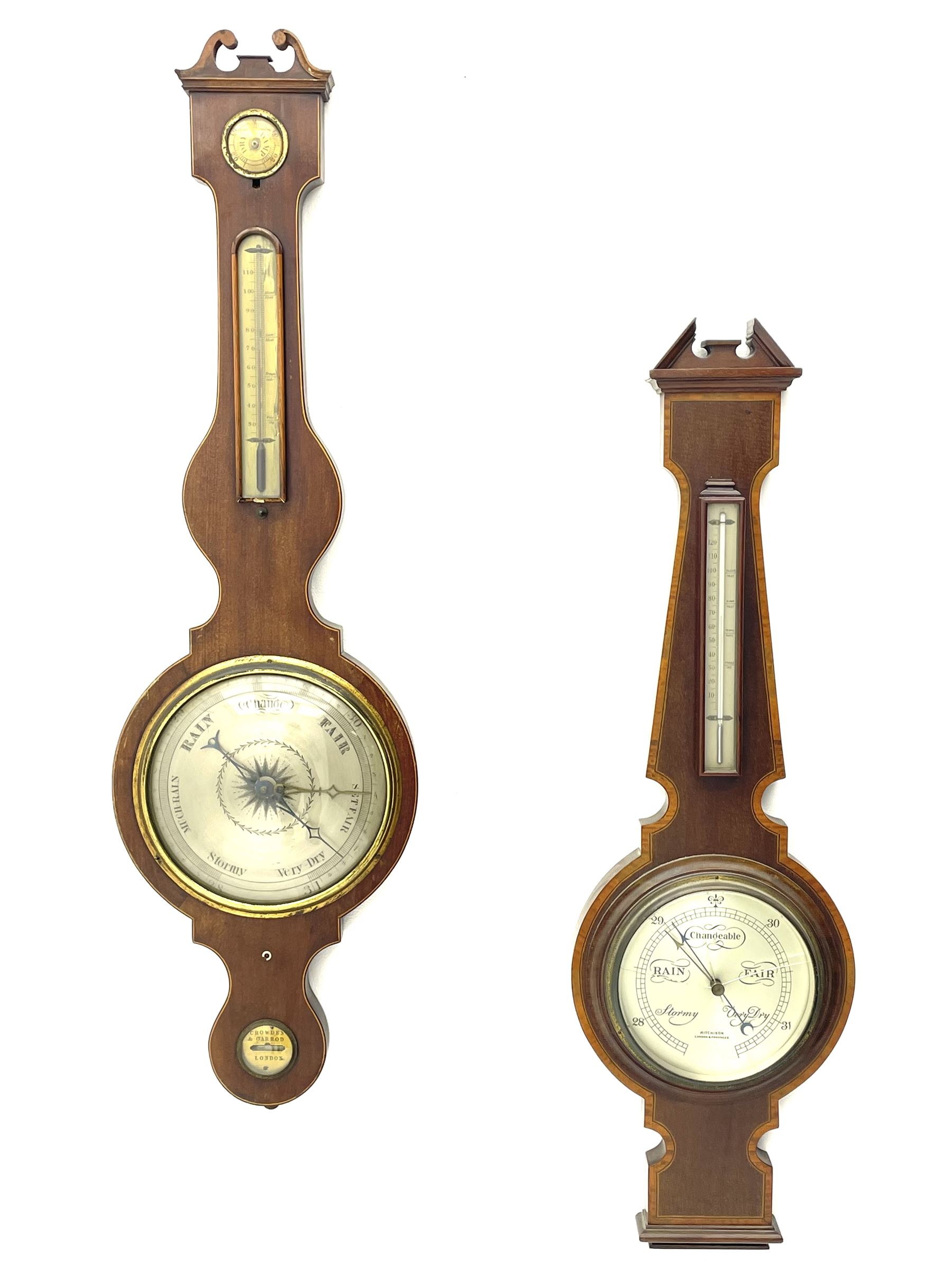 Early 19th century mahogany banjo barometer, scroll pediment over dry/damp and thermometer dials with brass registers, by ‘Crowden & Garrod, London’ (H107cm), and an early 20th century walnut and satinwood banded barometer by ‘Aitchison, London’ (H96cm)