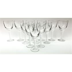 Two sets of wine glasses, probably Stuart Ariel, each with air twist stems, comprising six glasses in each set, each set approximately H18cm