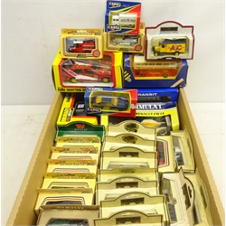 Thirty-two boxed diecast model vehicles including Lledo 'Days Gone', Corgi, Bburago 1/25 scale model of an Audi Quattro GT, another similar etc, in one box   