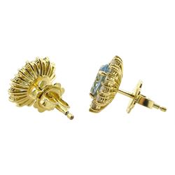 Pair of 18ct gold oval aquamarine and diamond cluster stud earrings, hallmarked, total aquamarine weight approx 1.65 carat, total diamond weight approx 0.55 carat