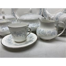 Royal Doulton tea and dinner wares in the Meadow Mist pattern, no H5007, comprising seven dinner plates, eight side plates, two lidded tureens, two jugs, lidded sucrier, oval serving dish, six teacups, seven saucers, seven tea plates and large saucer