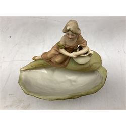 Royal Dux figure modelled as a recumbent woman, upon a conch shell, no. 1750, with applied pink triangle mark to base, H21cm