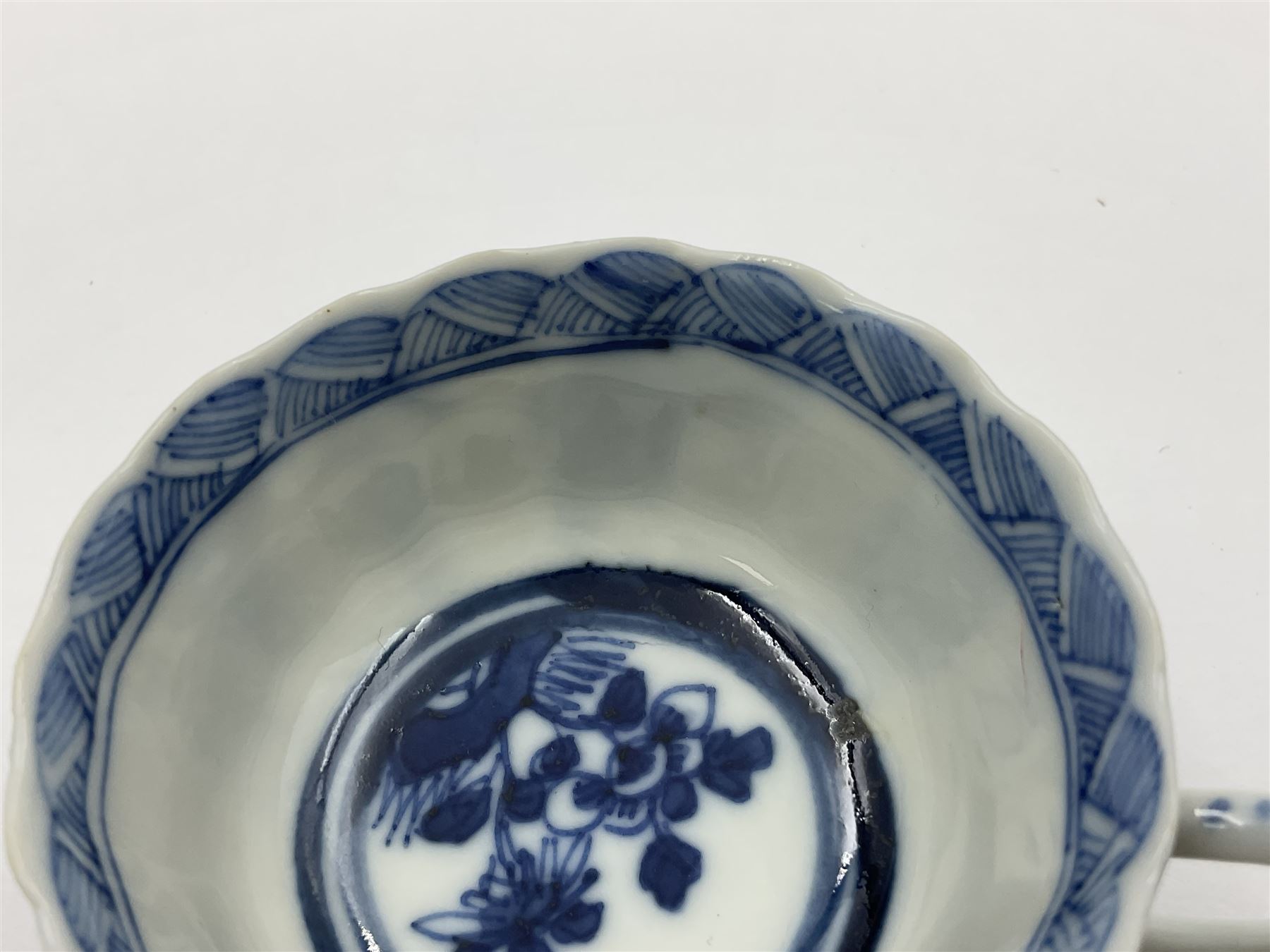 18th century Chinese blue and white Kangxi teacup and saucer, decorated with dancing figures, four character Kangxi mark beneath, saucer D10cm
