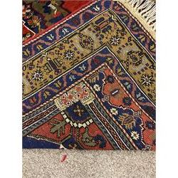 Turkish Taspinar rug, blue ground with central lozenge and medallion, the outer borders decorated with stylised motifs
