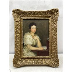 Theodore Blake Wirgman (British 1848-1925): Portrait of a Lady in her Study, oil on canvas signed 35cm x 24cm 