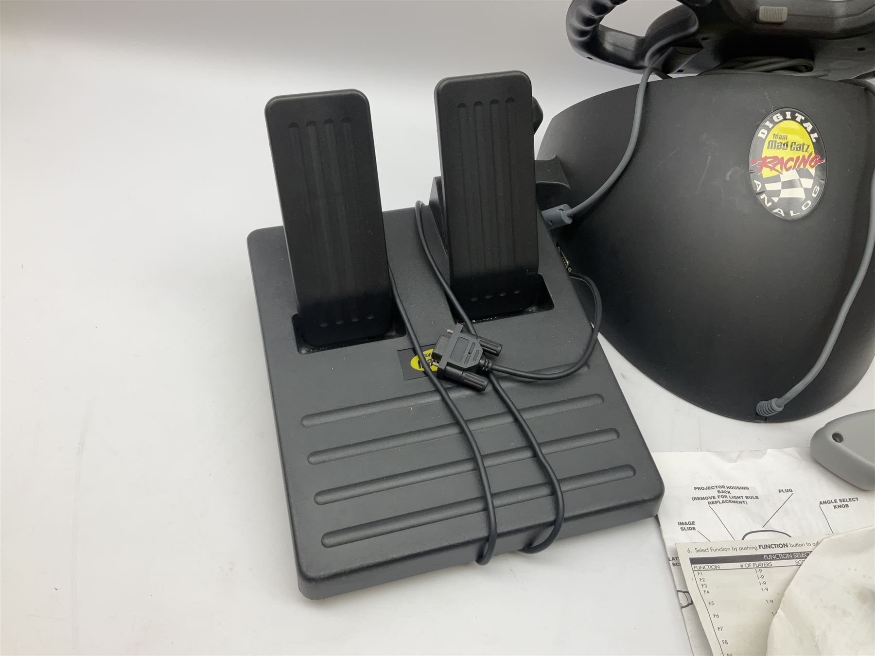 Mad Catz Dual Force Racing Wheel and Foot control for Playstation; Arcadia Image Projecting Game System; pair of Captain Scarlet and the Misterons phaser guns etc