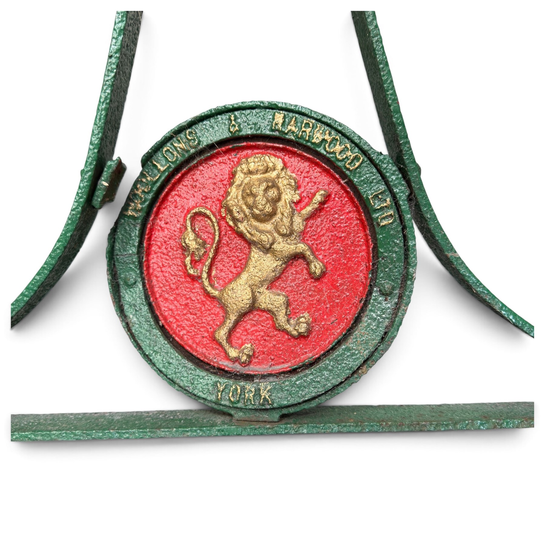 Woollons & Harwood Ltd., York - Edwardian green and red-painted cast iron garden roller, handle and stem over circular rampant Lion plaque stamped with maker