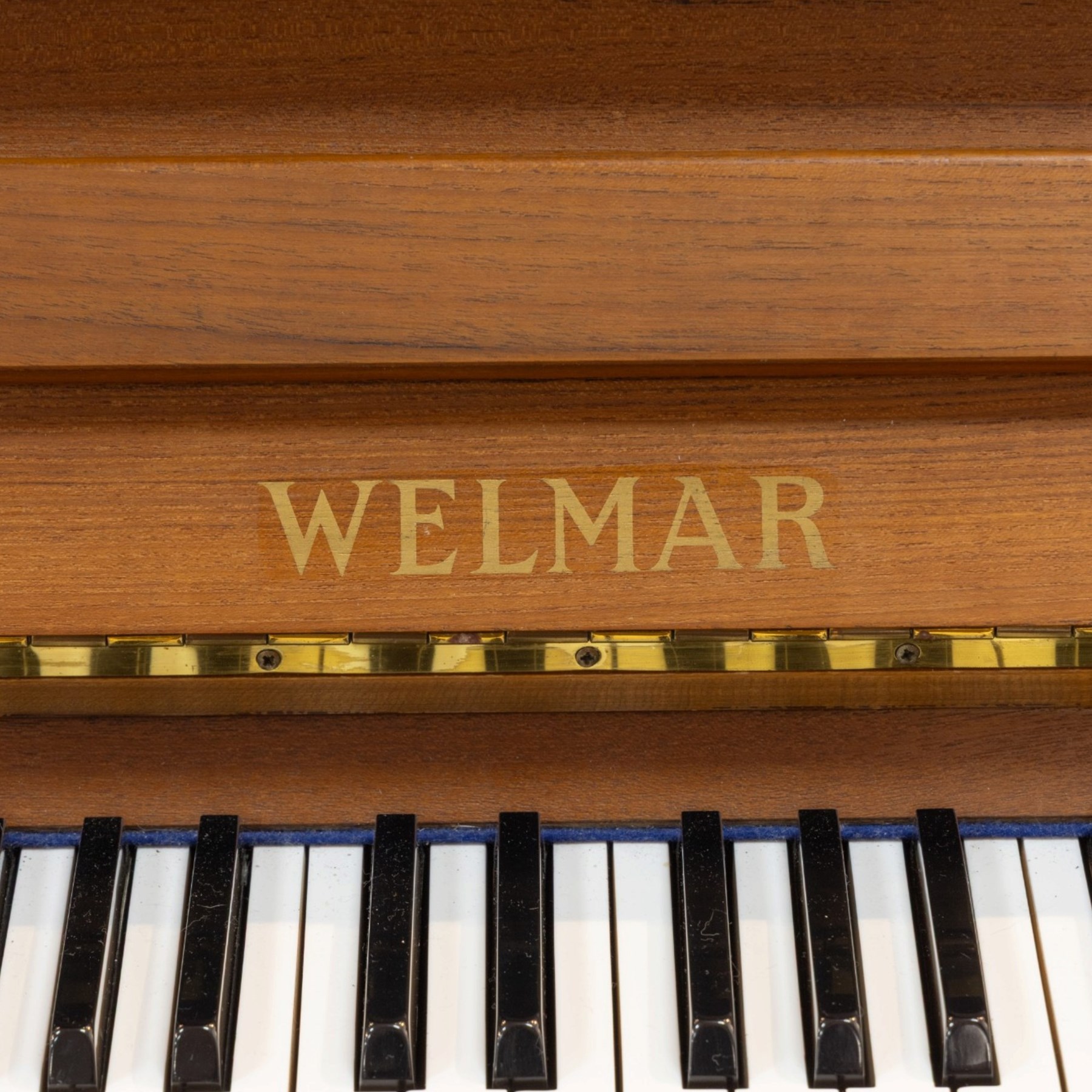 1970s century Welmar mahogany cased upright piano, retailed by The Piano Centre Rotherham, serial no. 75618, H110cm, W141cm