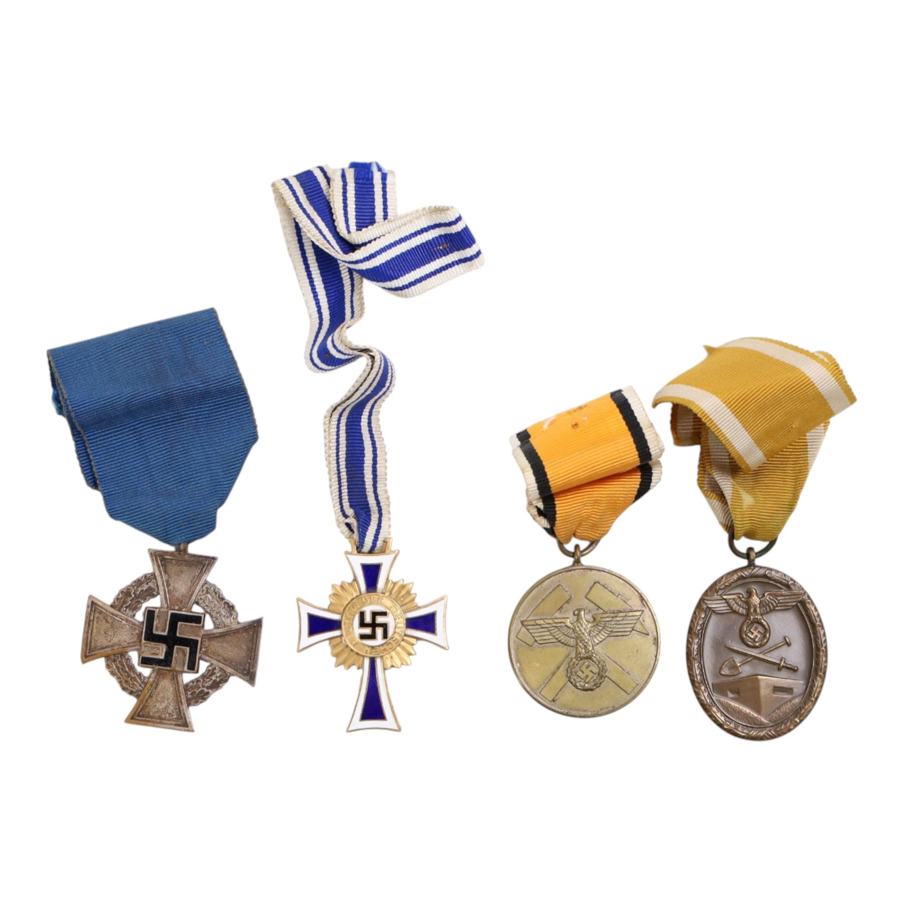 WWII German medals, comprising Cross of the Honour of the German Mother, gold, Westwall medal, Mine Service medal and Faithful Service medal