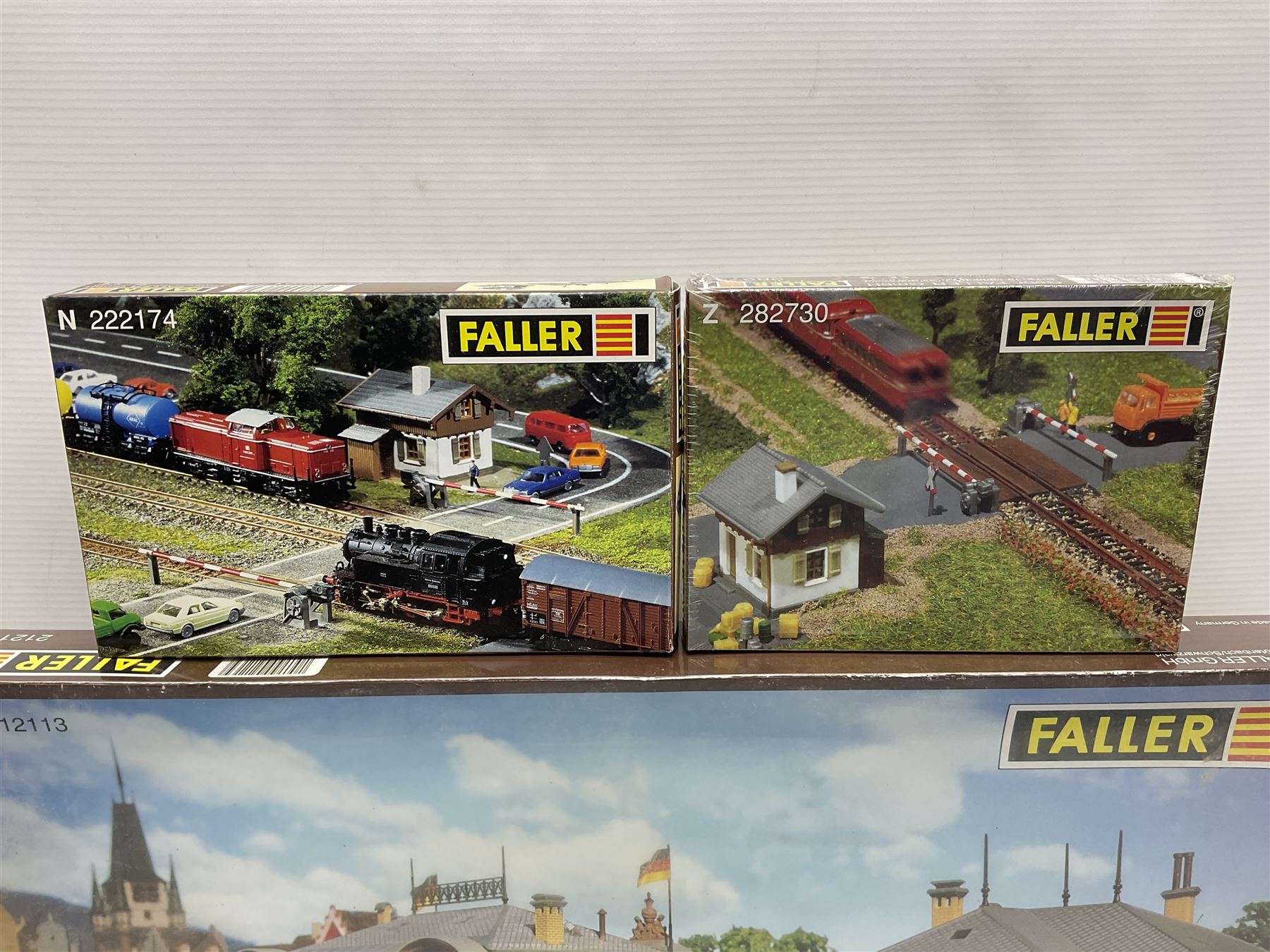 'N' gauge trackside accessories - seven Faller buildings and bridges etc Nos.N212113, N222121, N222583, N222174, N222128, Z282730 & Z282707; two others by Vollmer Nos.N7657 & N7724; four boxes of Gaugemaster Ballasted Underlay; grit and Foliage Clusters