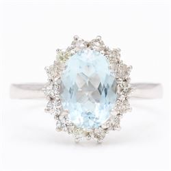 18ct white gold aquamarine and diamond cluster ring, single oval cut aquamarine of approx ...