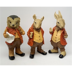 Three composite garden ornaments modelled as woodland animals in human dress, tallest H46cm.  