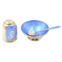 Mid 20th century Danish silver-gilt and guilloche enamel cruet set by Volmer Bahner, comprising pepper shaker, open salt and salt spoon, the spoon handle and bowl interior with blue basse taille enamel and vine motif, the pepperette with panels of blue guilloche enamel with similar applied vine decoration, all stamped Sterling Denmark VB, pepperette H4cm