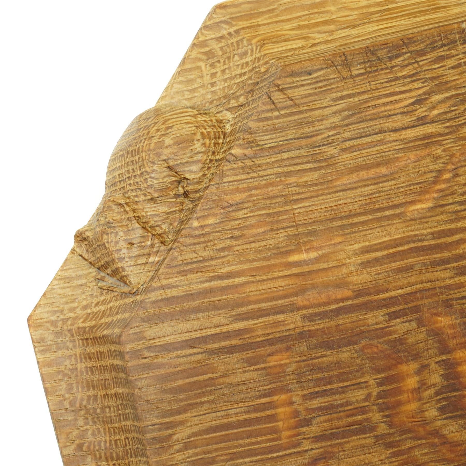 Mouseman - oak chopping board, of canted octagonal form, with carved mouse signature, by the workshop of Robert Thompson of Kilburn