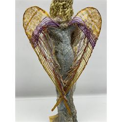 Anna Meszaros Hungary - hand made needlework figurine of an Angel with metallic lace full length dress and open threadwork wings; on moulded base H45cm Auctioneer's Note: Anna Meszaros came to England from her native Hungary in 1959 to marry an English businessman she met while demonstrating her art at the 1958 Brussels Exhibition. Shortly before she left for England she was awarded the title of Folk Artist Master by the Hungarian Government. Anna was a gifted painter of mainly portraits and sculptress before starting to make her figurines which are completely hand made and unique, each with a character and expression of its own. The hands, feet and face are sculptured by layering the material and pulling the features into place with needle and thread. She died in Hull in 1998.