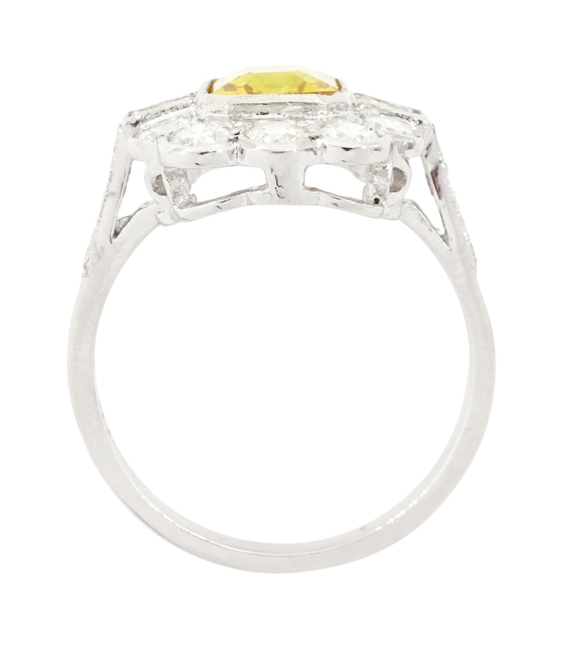 Platinum yellow sapphire and diamond milgrain set cluster ring, single octagonal cut sapphire of approx 2.20 carat, surrounded by two baguette cut diamonds and ten transitional cut diamonds and diamond set shoulders, stamped Plat, total diamond weight approx 0.95 carat
