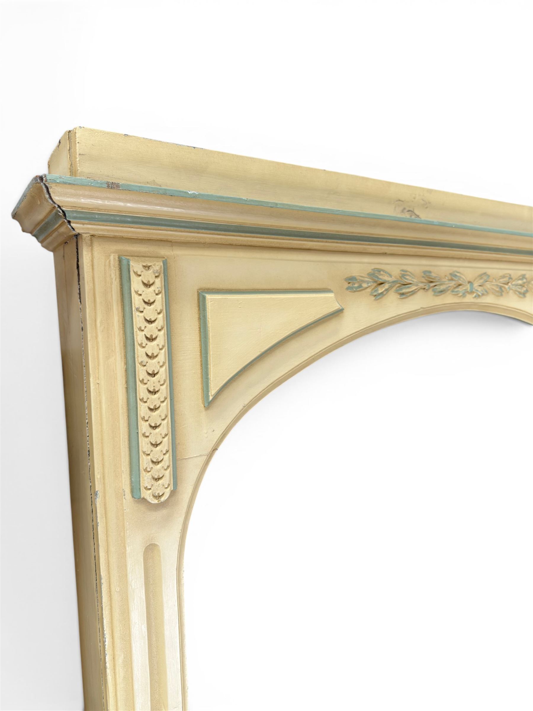 Two large painted pine window or door surrounds, square cornice with arch top, applied mouldings (widths 180cm and 130cm)