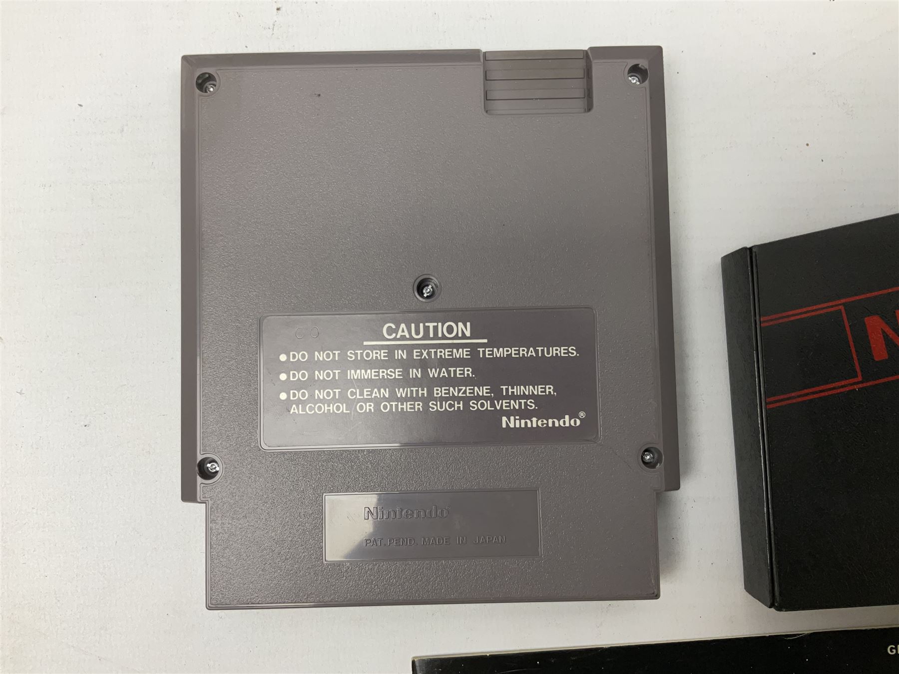 Nintendo Entertainment System (1985) console with two controllers, accessories and instruction booklet. NES Games ‘Duck Hunt’ with Nintendo Zapper gun, ‘Pinball’ and ‘Super Mario Bros.’, all with original sleeves and instruction booklets. NES game ‘Super Mario Bros. 2’ cartridge only