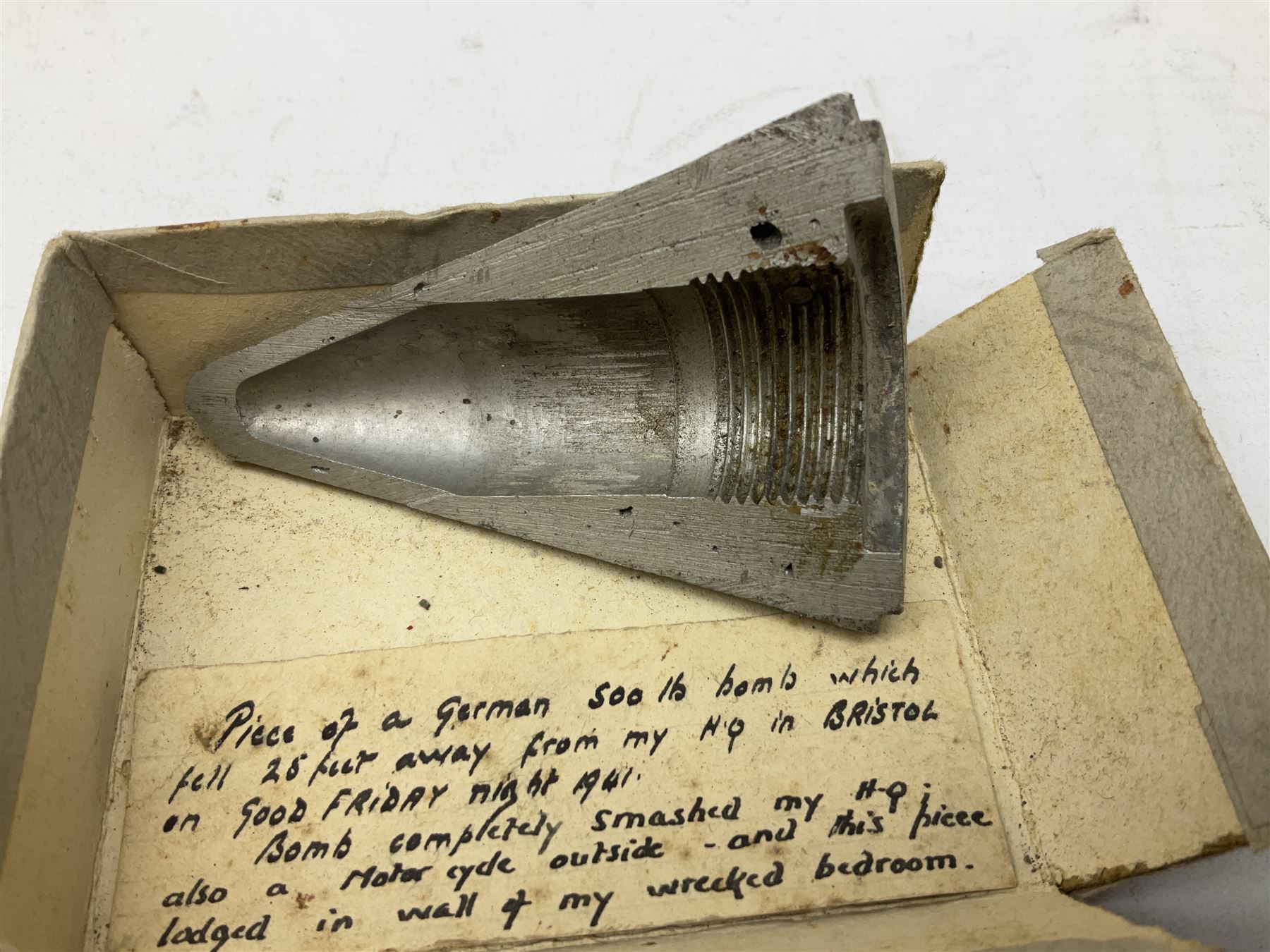Small collection of WW2 shrapnel and German and British shell parts, most with manuscript details of where and when found including London, Leeds, Bristol, Linton-on-Ouse etc