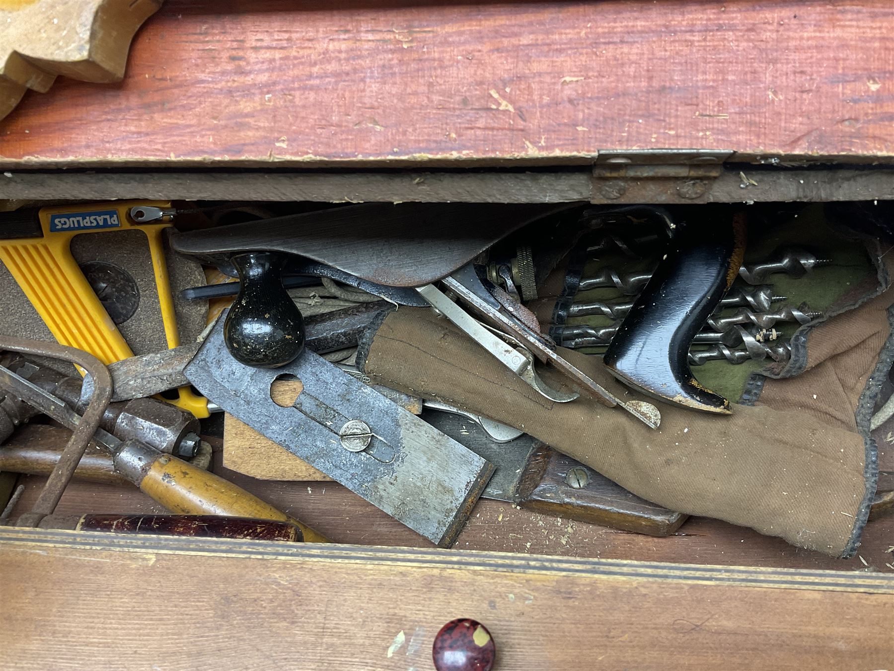 Large wooden tool box and carpenters tools, to include tenon and panel saws, box plane, mallet, chisels etc