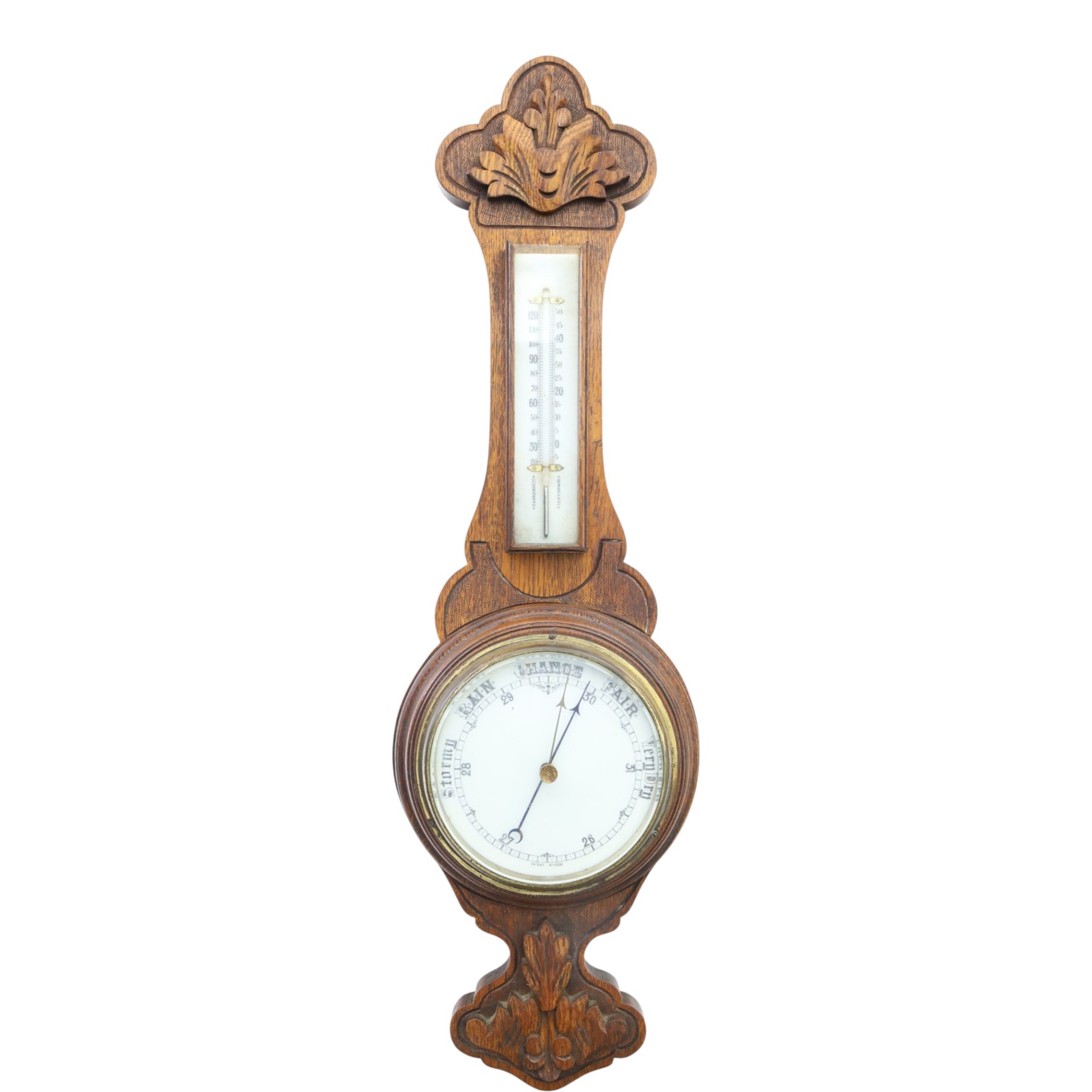 Late Victorian carved oak aneroid barometer, the foliate crest above a glazed thermometer and circular dial, with further carved decoration below, H 75cm