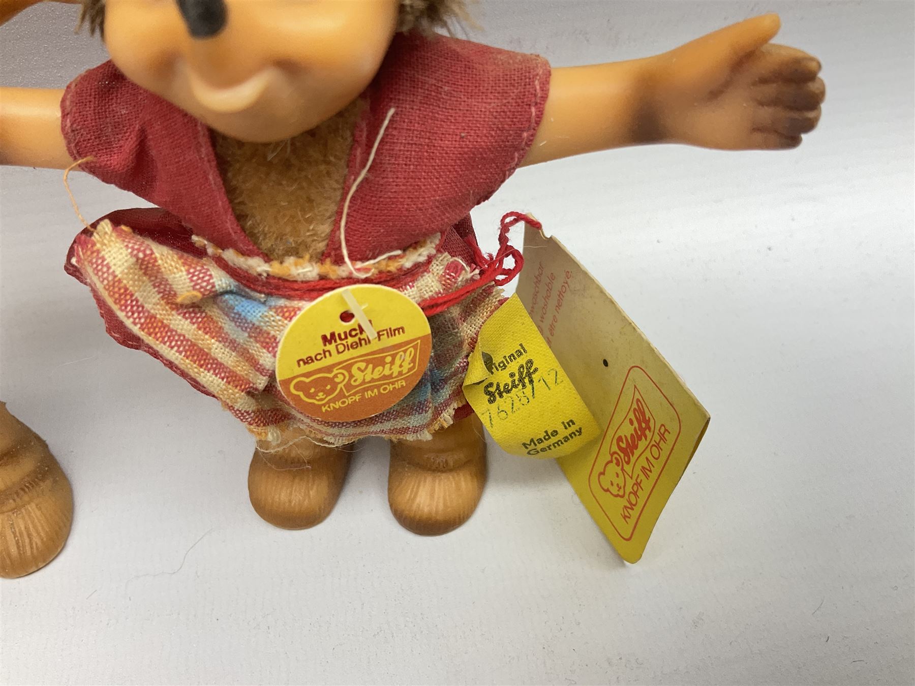 Group of Steiff figures, comprising Mikki and Mukki, circa 1950s no 7628/12 and 7627/12, with original tags, two hedgehogs no 1570/10, and another smaller 1670/03, small owl no 7480/06, and painted metal Steiff harlequin style bear