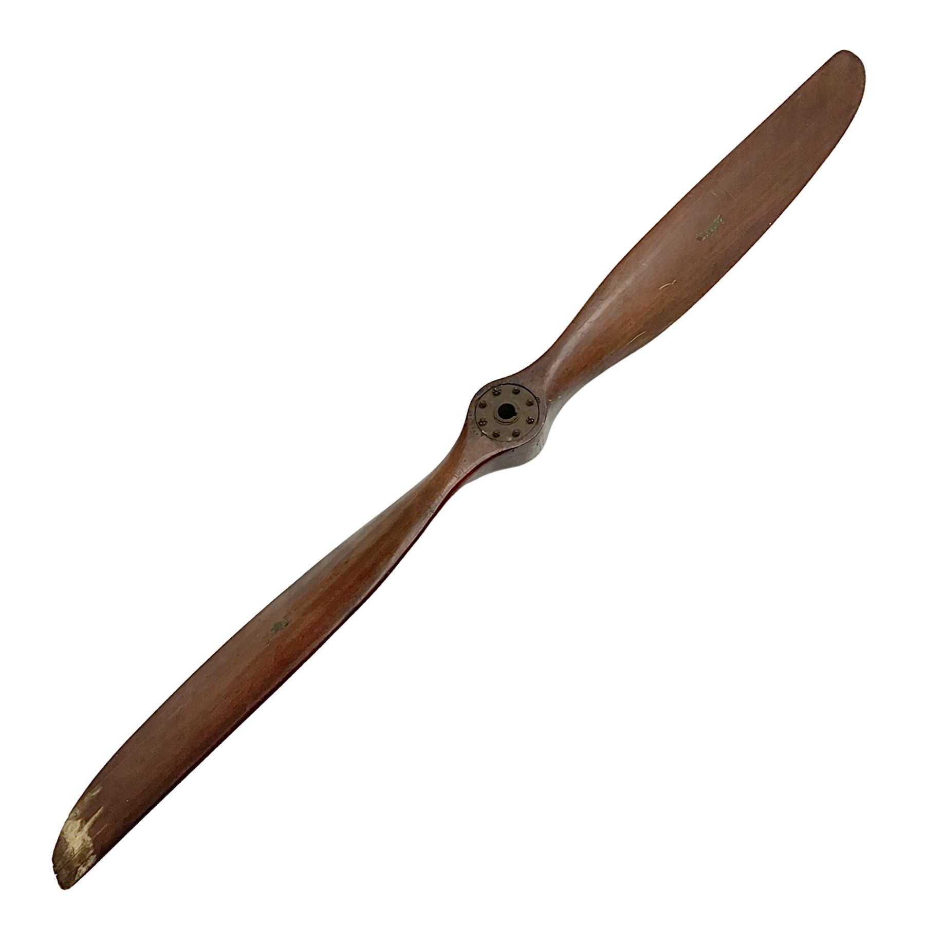 Early 20th century Avro 504 80HP Gnome laminated mahogany two-blade propeller with metal centre to the hub, stamped to the face of the hub 'AVRO Y80 80HP GNOME TYPE 504 & 504A A.I.D.29 A.I.D.32 1545' and to the sides of the hub '2744 DIA 1829 PITCH' and '1470'; traces of A.V. Roe & Co Ltd Manchester transfers to both blades L273.8cm; Auctioneer's Note: The Avro 504 was introduced in 1913 and was quickly taken up by the Royal Flying Corps as a trainer and observation machine; robust and versatile it remained in general service as a trainer until the late 1920s then widely for civilian use as a joy-rider and for stunt displays. The legendary RAF WWII ace, Douglas Bader, took instructions and would have had his first solo flight in just such a machine.