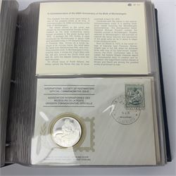 Thirty-one 'International Society of Postmasters Official Commemorative Issues' sterling silver proof medallic covers dating from 1975 to1977, housed in the official folder and a 'Commemorating The Bicentennial Of The United States Of America' sterling silver proof medallic first day cover in blue wallet