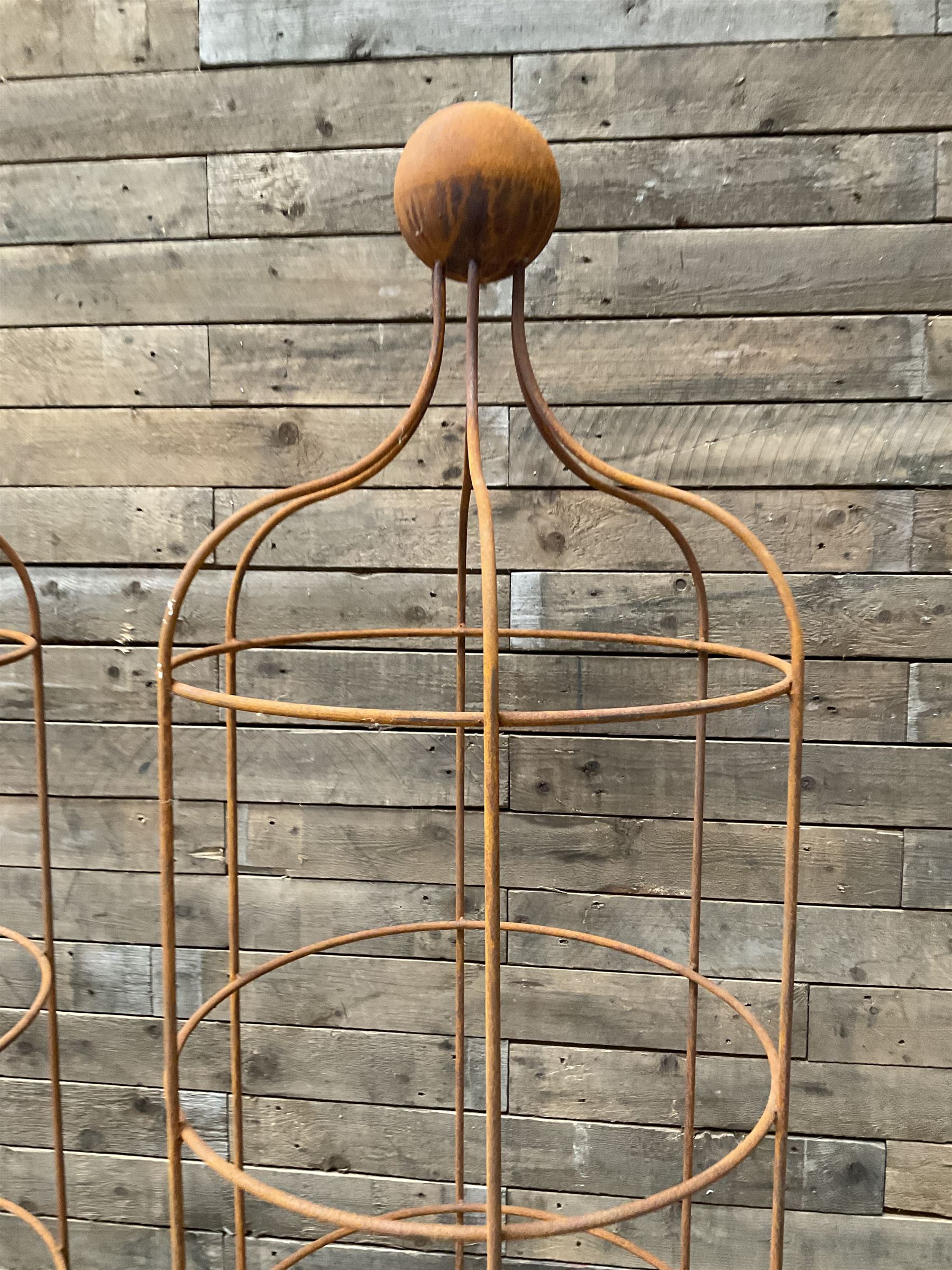 Pair of Country House wrought iron garden obelisks with ball finial, raise in four tiers