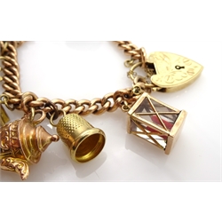 9ct gold curb link chain bracelet, with heart padlock, eight 9ct gold charms including swivel fob, book and first aid and two 14ct citrine and  clog charms, all hallmarked or tested, approx 42.1gm 