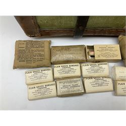 WW2 British Army RAMC 'Regimental Medical Pannier', well marked externally and dated 1941, stamped May 1943 internally, canvas covered wicker form with leather edges, hinged top and fall front with two rope carrying handles, fitted iron locking straps with securing chains; contains various unused field dressings and bandages with WW2 dates and two pillows; original label under lid L79cm