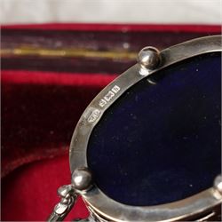 Set of four Edwardian pierced silver salts and matching mustard pot, all with blue glass liners Birmingham 1901 Maker William Devenport, cased, together with a pair of similar pepperettes 1900 Maker Walker & Hall, Georg Jensen sterling silver cauldron shape salt on ball feet, plated coaster, plated salt and silver topped jar