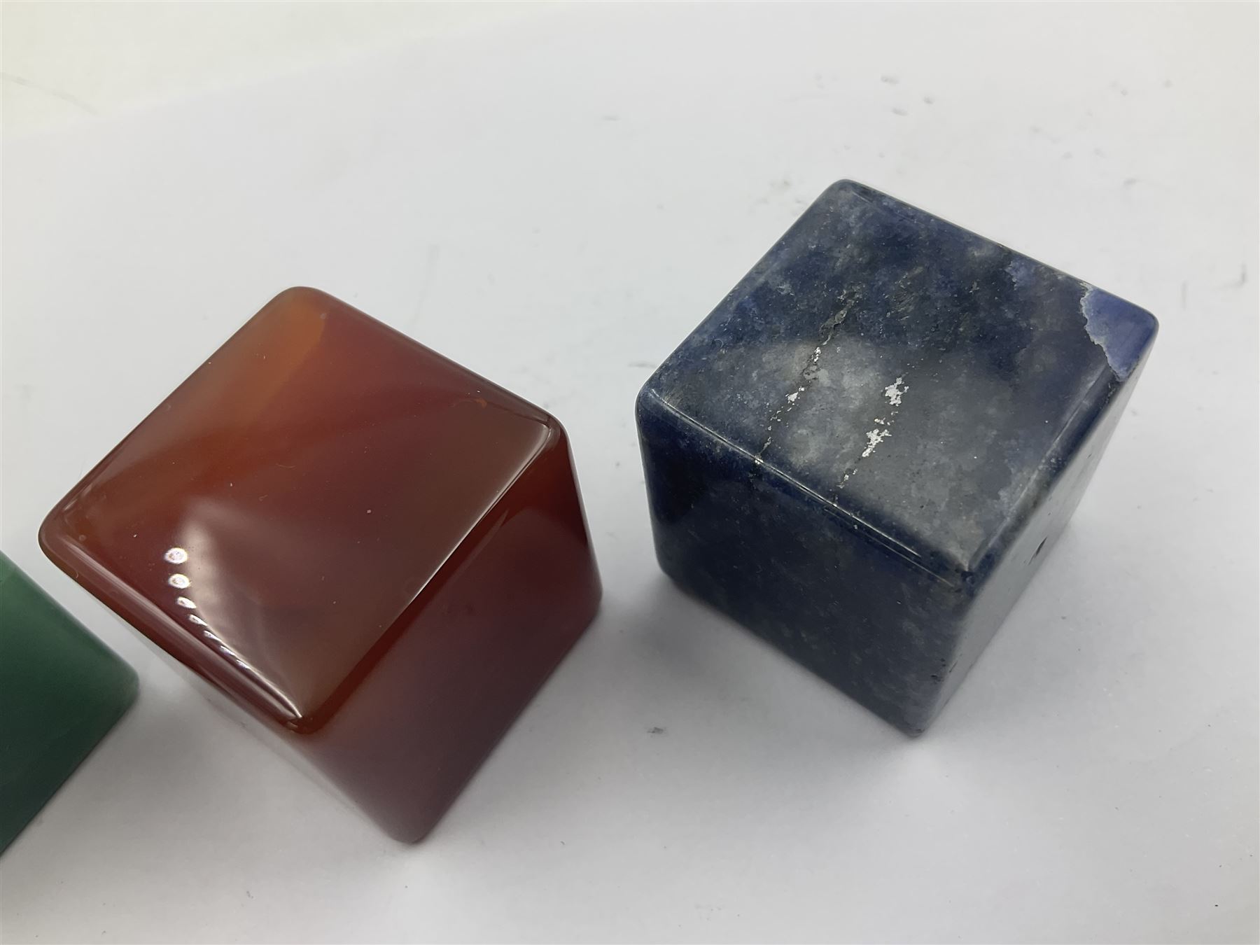 Ten cube mineral specimens, each cut and polished to highlight natural formations, including tiger eye, green aventurine, rose quartz, opalite, amethyst etc, H3cm 