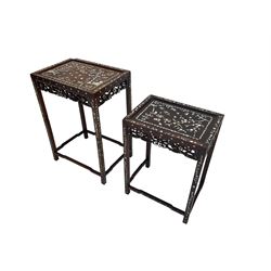 Nest of two mother of pearl inlaid hardwood tables, the rectangular tops decorated with cherry blossom trees and hunter inlay scenes, pierced and carved friezes with flowerhead and bird pattern, raised on square supports united by shaped stretchers