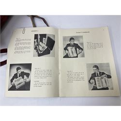 German Hohner student II compact accordion with 26 keys and 12 bass registers in a hard case With tutor