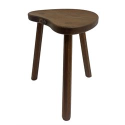 'Mouseman' oak three-legged stool, kidney shaped dished seat carved with mouse signature to edge, by Robert Thomas of Kilburn