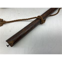 Tribal Art - an African axe, possibly Yoruba, the bone shaft carved as two cord bound stylised figures with iron fan-shaped blade, L35cm overall; and 19th century harpoon or spear head of square section with two long fixing arms on cut-down ash shaft L57cm (2)