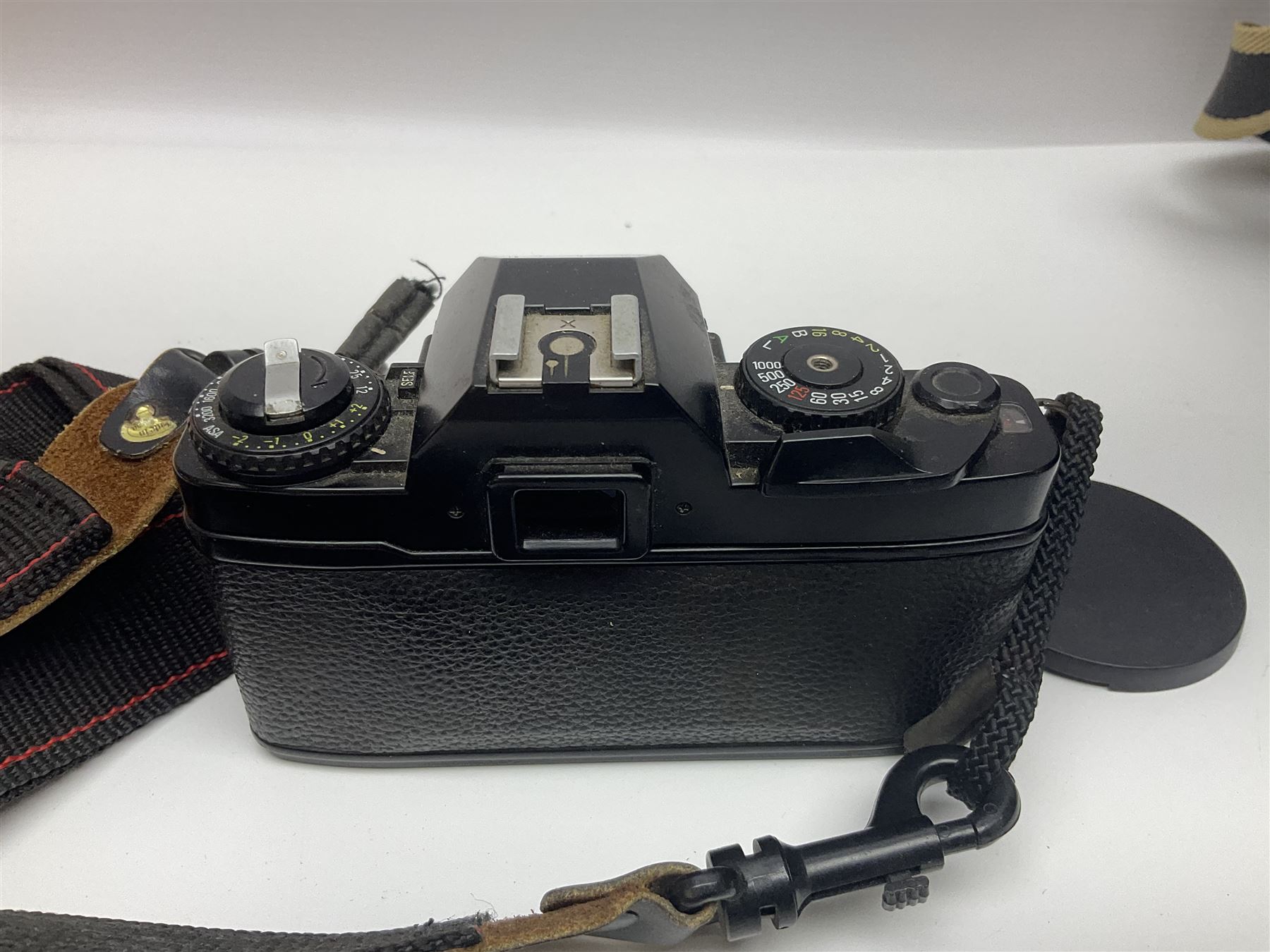 Four camera bodies, to include, Ricoh KR-10 serial no. 38826, Pentax MZ-M serial no. 4185969 with 'SMC Pentax- M 1:3.5 28mm' lens, Canon EOS500 serial no. 080927, with 'Sigma Zoom 100-300mm 1:4.5-6.7 DL'  lens etc, with other camera lenses and equipment 