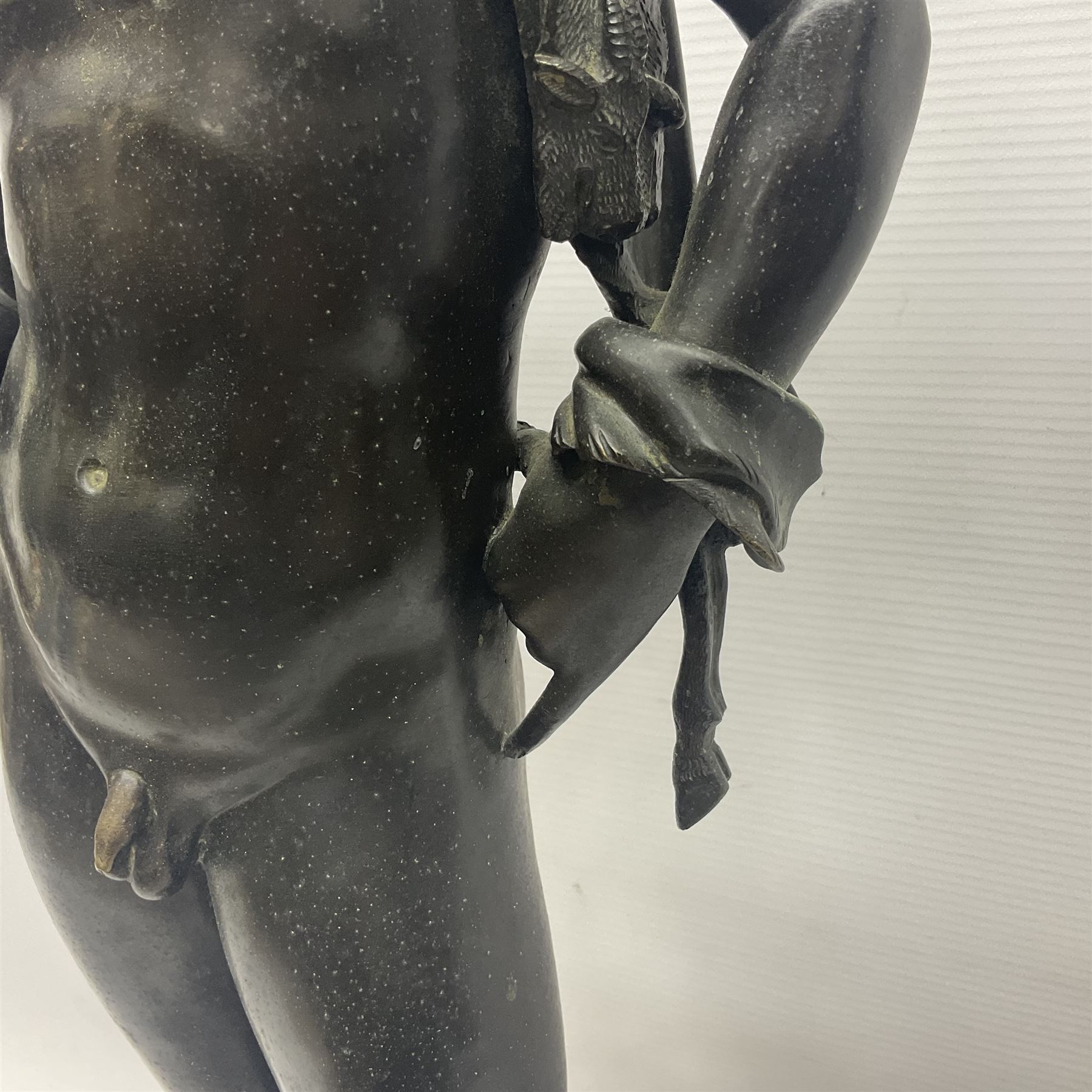 Bronzed classical nude male figure, upon a stepped circular base, H61cm 