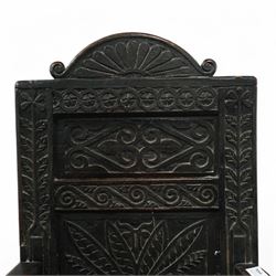 17th century and later carved oak Wainscot chair, the panelled back decorated with carved foliage and scrolls, the frame decorated with trailing guilloche and foliate motifs, moulded seat over turned supports united by stretchers 