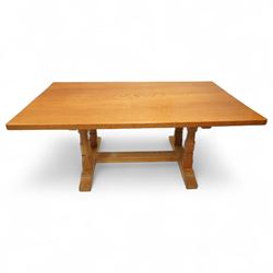 Beaverman - oak refectory table, with rectangular top, over shaped trestle end twin pillar...