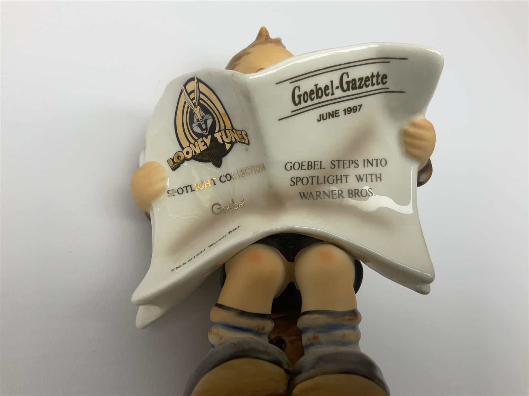 Thirty Hummel figures by Goebel, to include Saluting the Peacekeepers of Operation Joint Endeavor, on wooden plinth, Call to Glory, Celebrate with Song and Soldier Boy