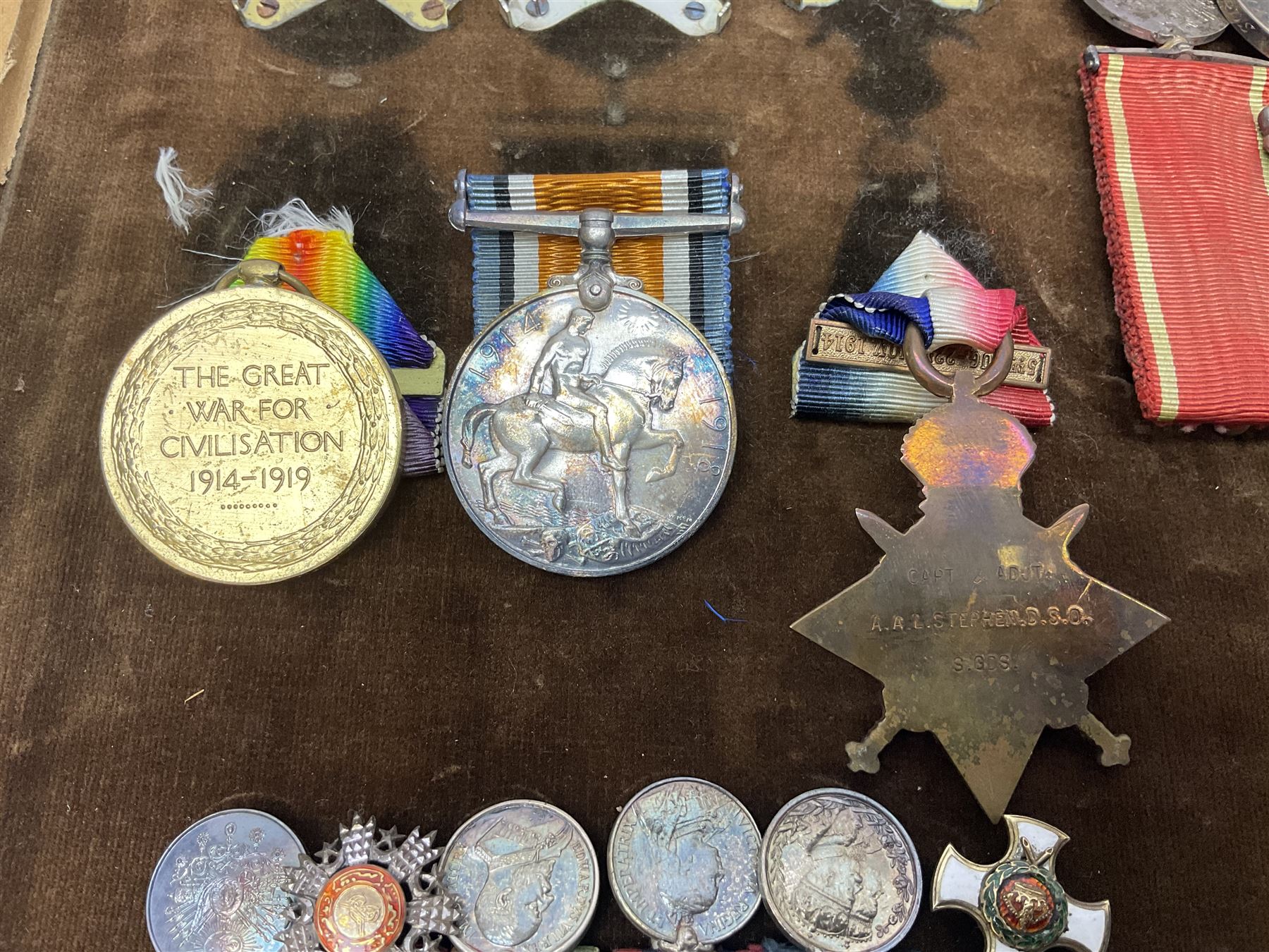 KIA (Ypres)  DSO group of eight Boer War/WW1 medals comprising Victorian DSO, Queens South Africa Medal with six clasps for Belmont, Modder River, Driefontein, Johannesburg, Diamond Hill and Belfast, Kings South Africa Medal with two clasps for South Africa 1901 and South Africa 1902, Turkish Liakat Medal, WW1 1914 Star with 5th Aug - 22nd Nov 1914 bar, British War Medal and Victory Medal and George V 1911 Coronation Medal, awarded to Lieutenant (later Captain) Albert Alexander Leslie Stephen Scots Guards; the group of six Boer War miniatures including additional Turkish Order of the Medjedie 3rd Class with rosette; all with ribbons and later mounted and framed with his bronze memorial plaque; together with Cecil Cutler (active 1886-1934) heightened watercolour three-quarter length portrait of Stephen in uniform, signed and dated 1915, 52 x 35cm; gilt frame;
Auctioneer's note: STEPHEN, ALBERT ALEXANDER LESLIE, Lieutenant, was born 3rd February 1879, son of Major J Z Stephen and Augusta Henrietta Mary (nee Ricketts). He was educated at Eton, and joined the Scots Guards 4th January 1899, becoming Lieutenant 4th April 1900. He served in the South African War, in which he was present at a large number of engagements. He took part in the advance on Kimberley, with the action at Behnont, and was present at Enslin, Modder River and Magersfontein, and also at the operations in the Orange Free State, Transvaal, Orange River Colony and Cape Colony, including actions at Poplar Grove, Driefontein, Vet and Zand Rivers; the action near Johannesburg, those at Pretoria, Diamond Hill and Belfast. From January 1901, he was Assistant Provost-Marshal to Pulteney's Column, and he was Intelligence Officer to Garrett's Column in 1902. He was twice mentioned in Despatches [London Gazette, 10 September 1901, and 29 July 1902]; received the Queen's Medal with six clasps; the King's Medal with two clasps, and was created a Companion of the Distinguished Service Order [London Gazette, 31st October 1902]: 