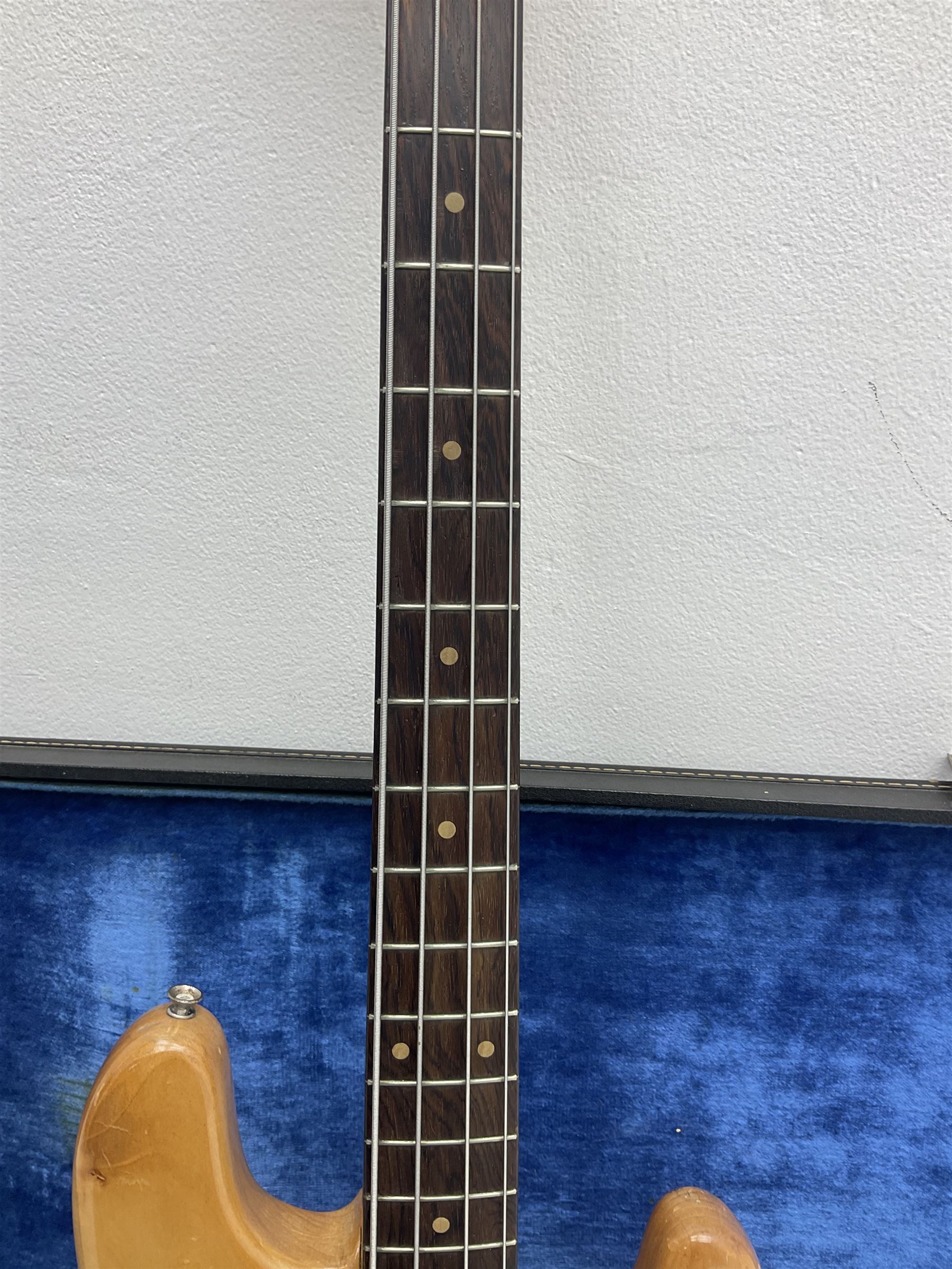 1962 Fender Precision bass guitar; re-finished in natural alder in the 1970s; impressed date code 5NOV62C to end of neck and serial no.90537 to back plate; L115.5cm; in replacement hard carrying case