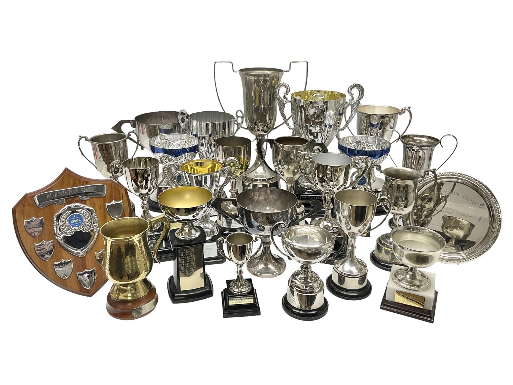 Collection of silver plated and metal trophy cups and winners plaques, all relating to the Burniston and District Show, most engraved with competitions and winner's names, in three boxes 