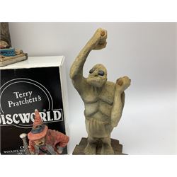 Terry Pratchett Discworld figures, designed by Clarecraft, comprising Lias Bluestone DW82, Hogfather DW72, Granny Weatherwax, boxed, DW06, Ridcully DW61and 'Ironcrust's genuine dwarf bread'.
