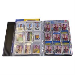 Collection of Football related stickers and albums, including Portugal Euro 2004 unused album and a collection of stickers,  Merlin The Official FA Premier League Sticker Collection 10th Edition 2003 unused album and stickers, Merlin The Official FA Premier League Sticker Collection 11th Edition 2004 unused album, Merlin The Official FA Premier League Sticker Collection 2001 unused album and stickers, Merlin The Official FA Premier League Sticker Collection 2002 unused album and stickers and Merlin's 2002 England unused album and stickers, housed in two folders