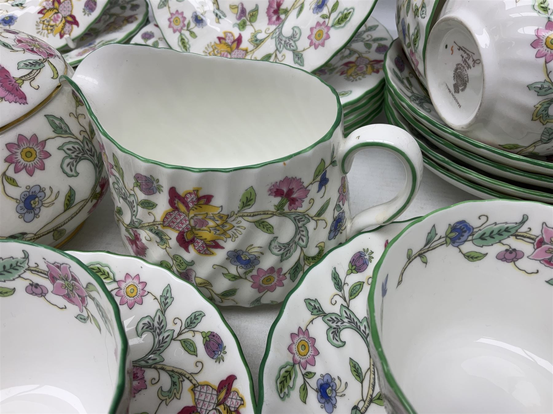 Minton Haddon Hall pattern tea wares comprising twelve teacup trios