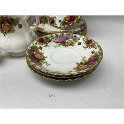 Royal Albert Old Country Roses tea service, comprising teapot, milk jug, covered sucrier, open sucrier, salt and pepper, twelve dessert plates, cake plate, seven cups and eight saucers  