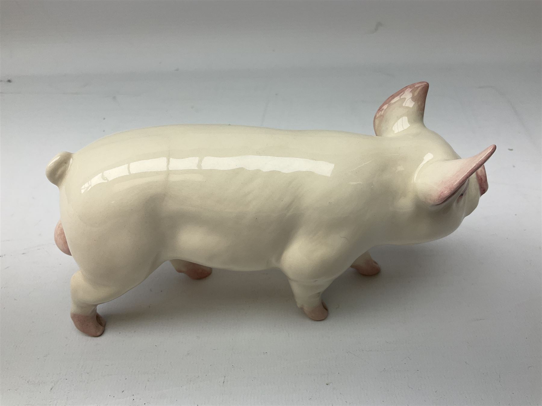 Collection of Beswick pig figures, to include John Beswick Little Likeables ‘Hide and Sleep’, white boar pig and John Beswick trio of pigs, all marked beneath (5)